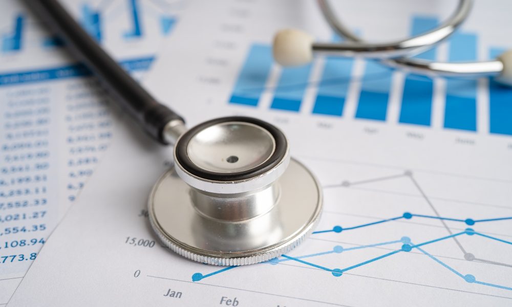 Stethoscope on chart and graph paper, Finance, Account, Statistics, Investment.